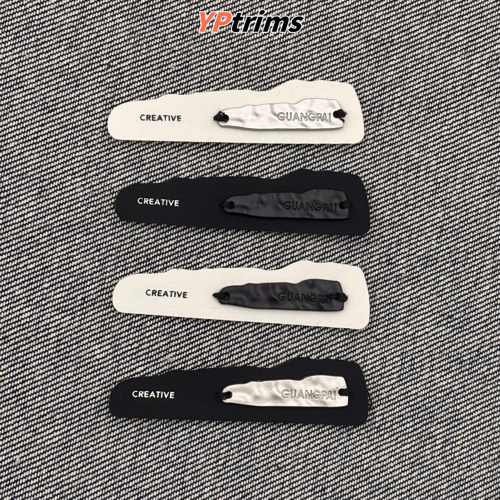 custom hand-sewn irregular metal patch | black & white clothing label for hats, shoes & menswear supplier