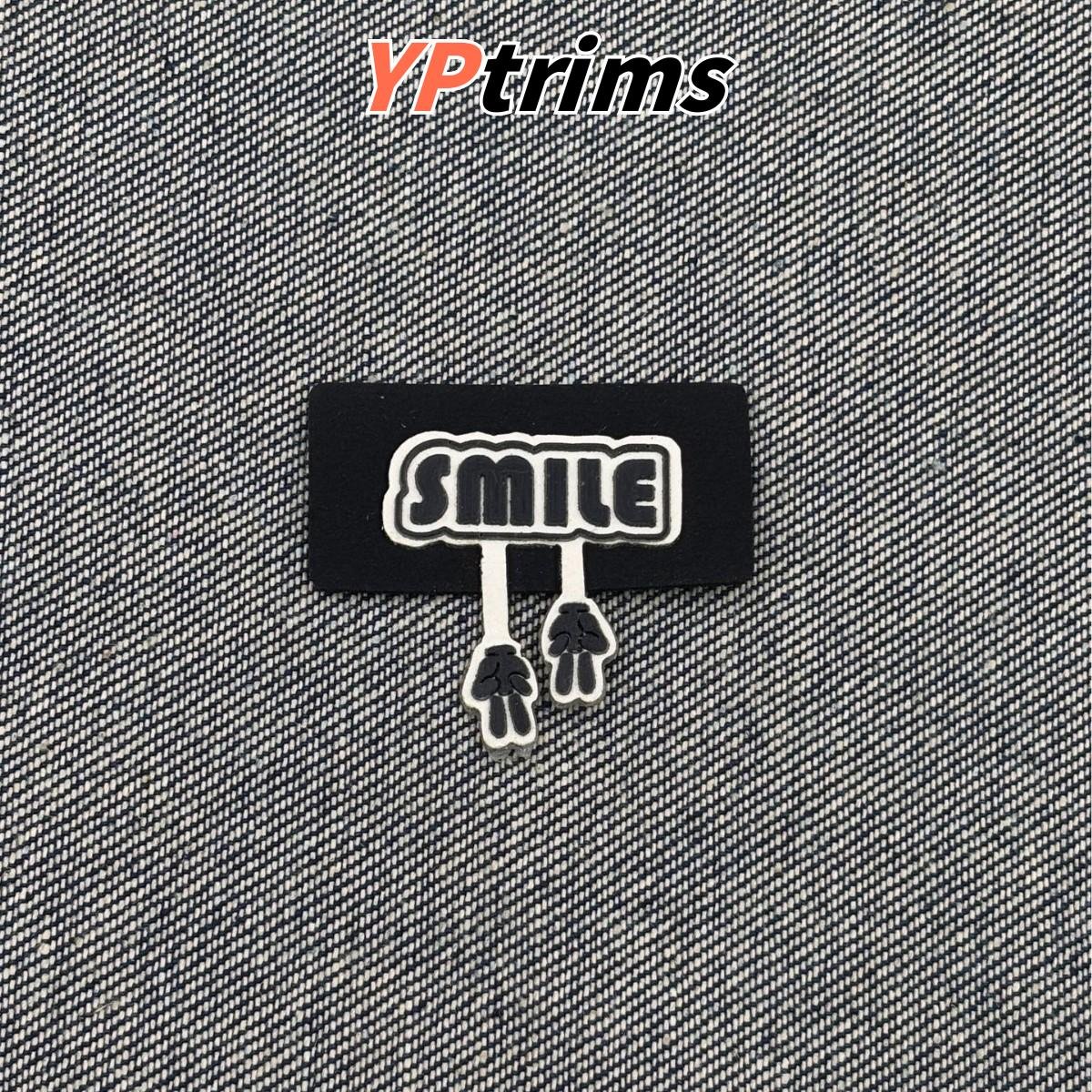 custom kids clothing patch with letter & hand shape – sew-on hat & shoe label factory