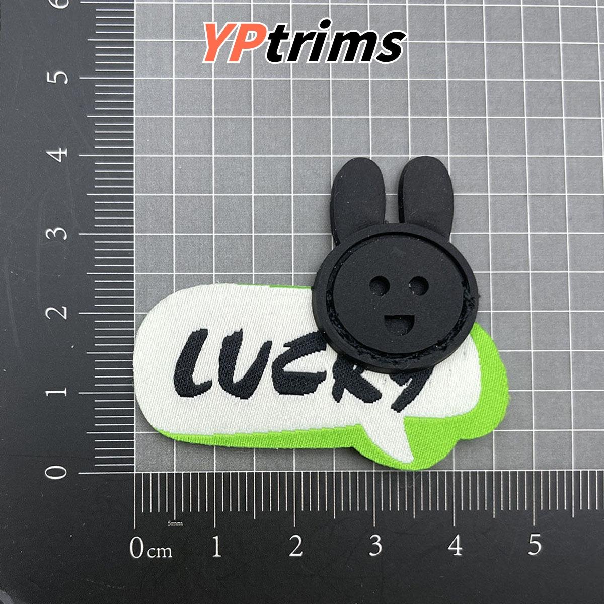 custom grey reflective embossed round leather patch for jackets, pants & bags – garment label factory