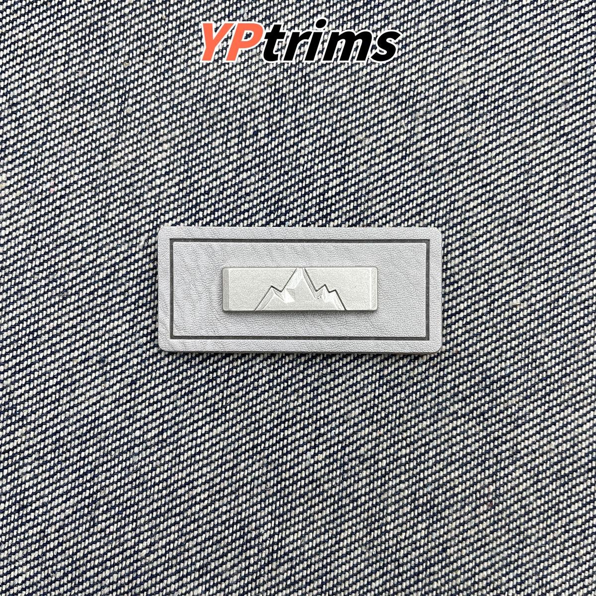 wholesale mountain pattern leather tag with metal decoration – outdoor fashion garment label | supplier