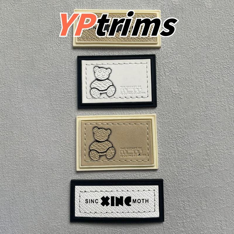 custom rectangular pvc little bear pattern sewn combination leather label for trendy pet and kids' clothing